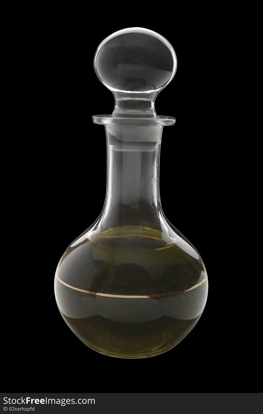 Golden sunflower oil in glass decanter. Isolated on black background. Golden sunflower oil in glass decanter. Isolated on black background