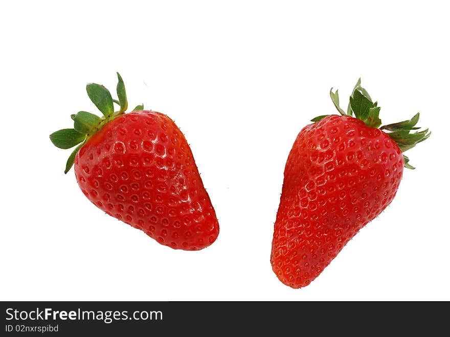 Two strawberries on white background