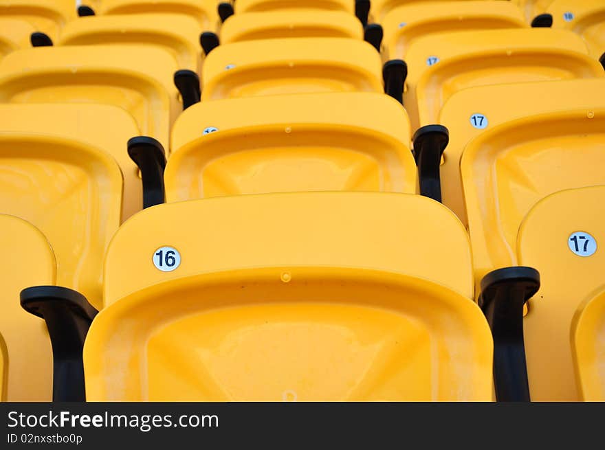 Folding yellow seat in arena