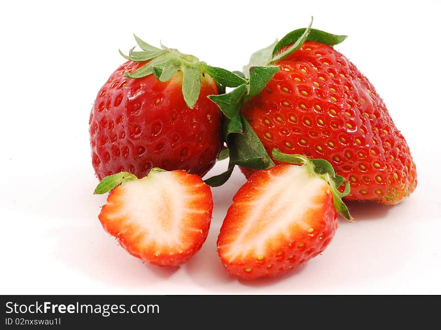 Whole strawberries and cut strawberries. Whole strawberries and cut strawberries