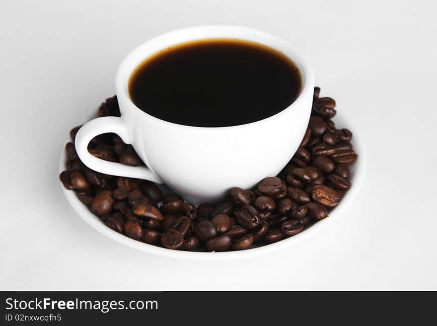 Cup of strong coffee, neutral background