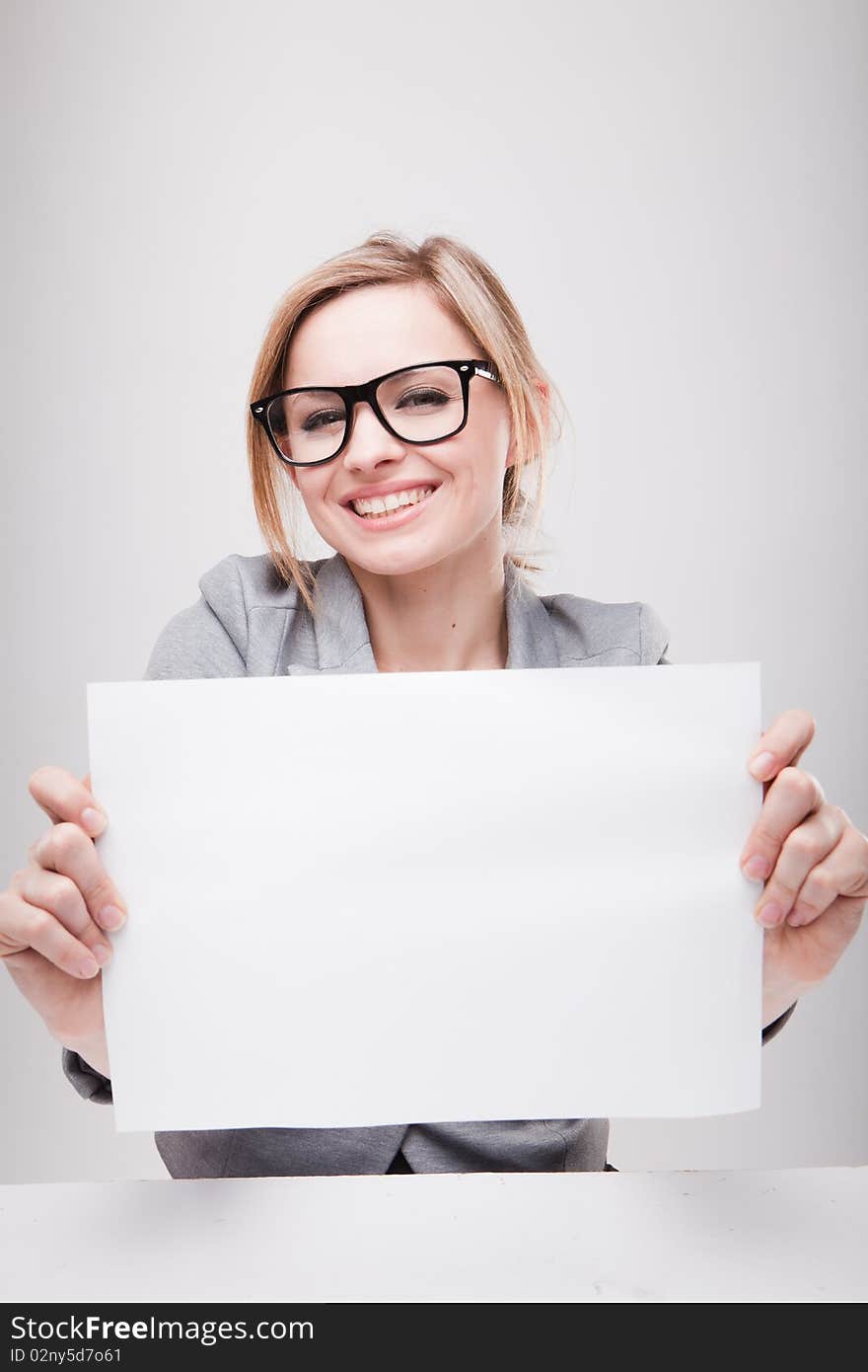 Young business woman holding empty white board