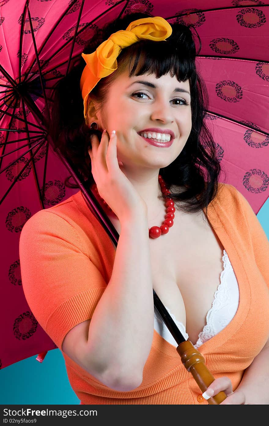 Busty woman holding umbrella