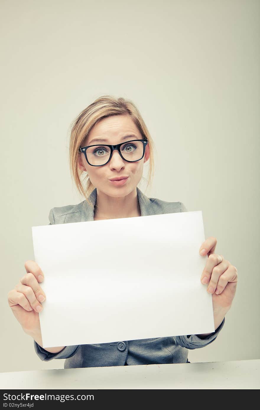 Young business woman holding empty white board