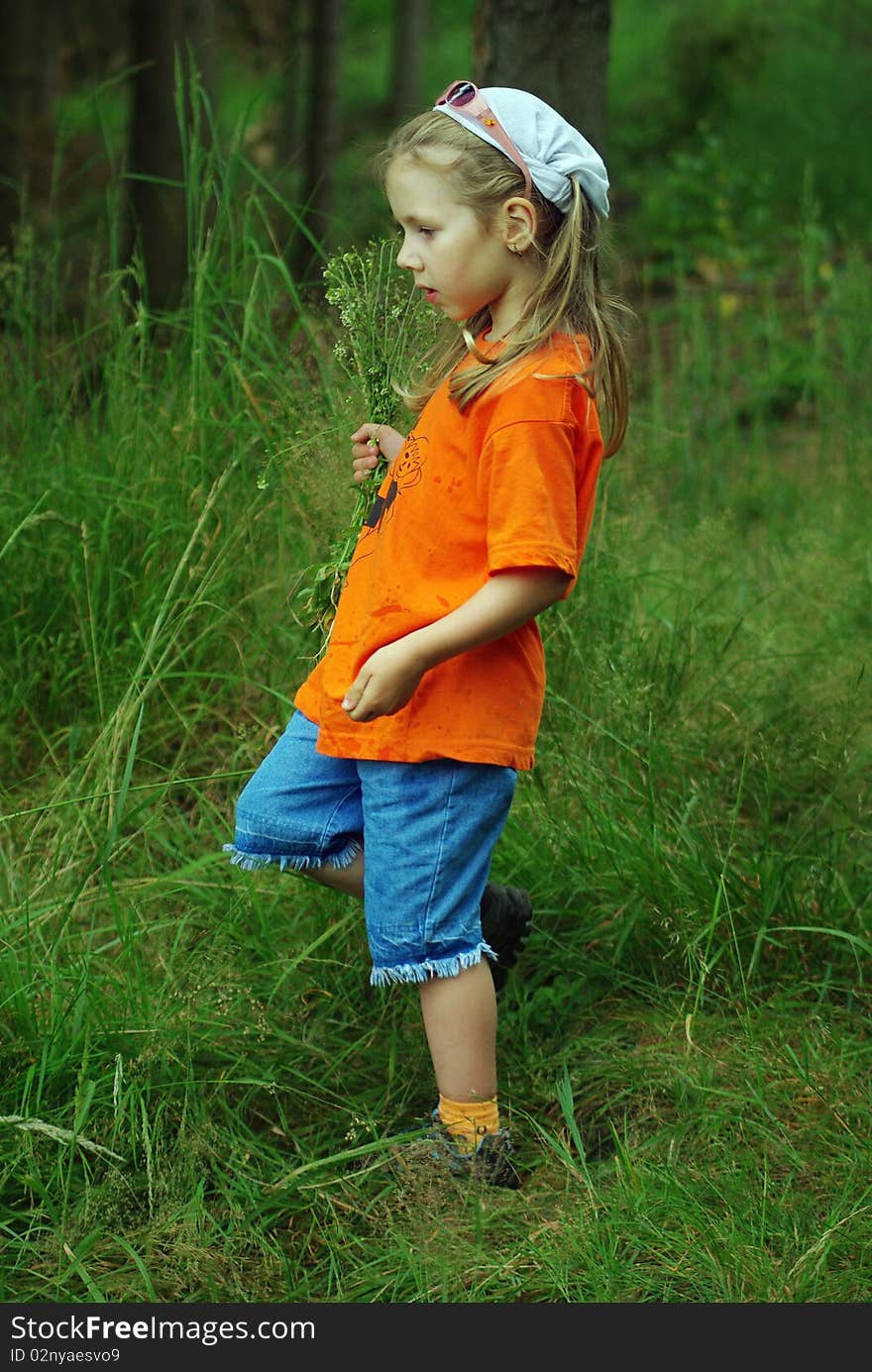 A young girl on a walk through the woods