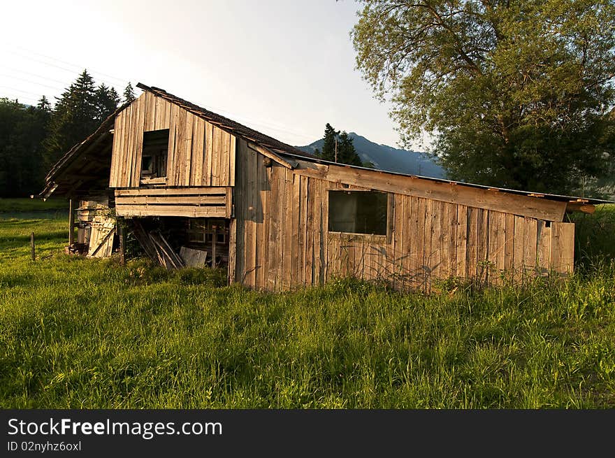 An old wooden barn during sunset