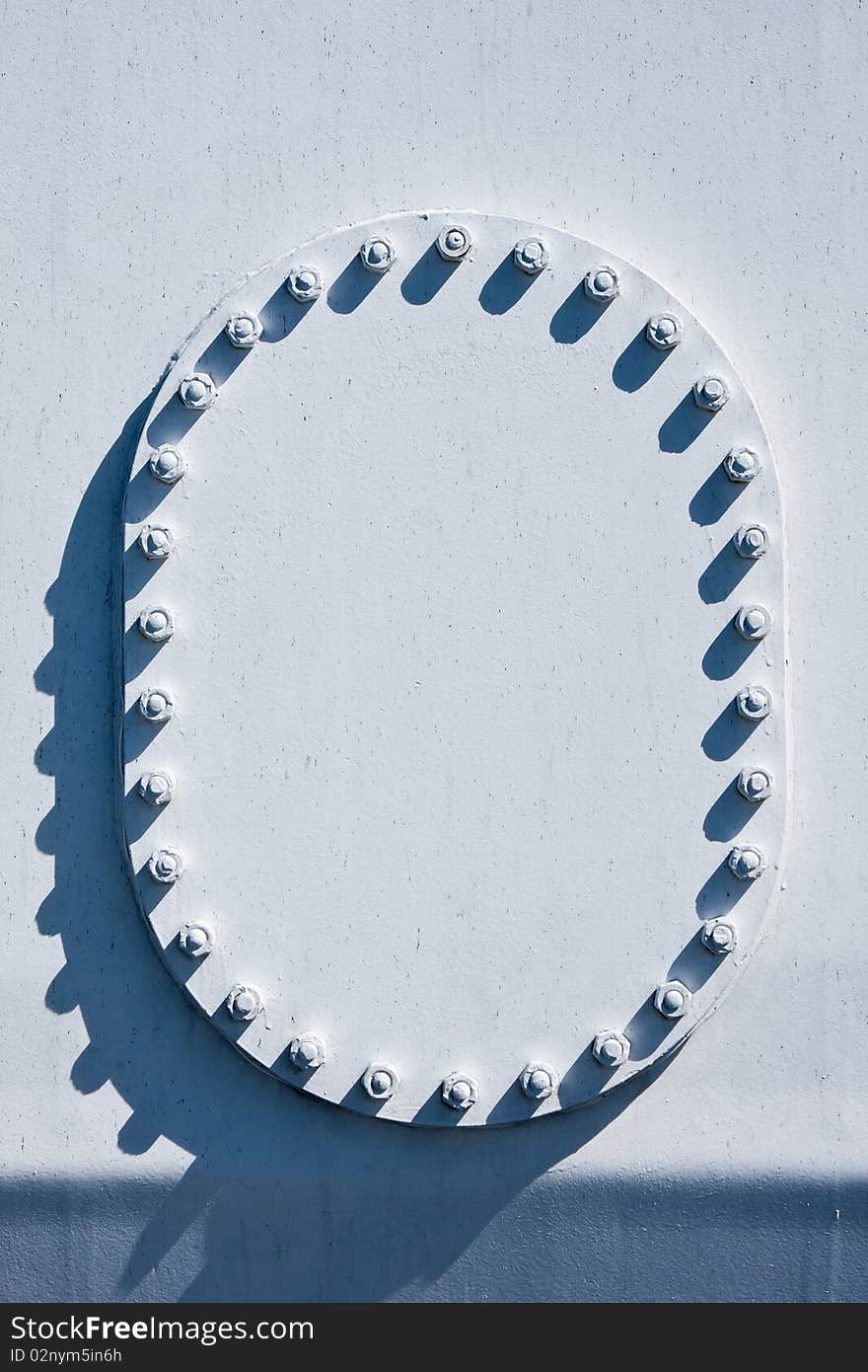 White painted metal portal with bolts