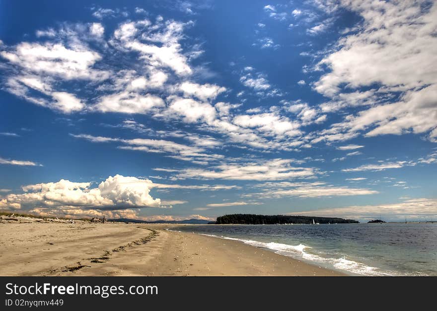 Sandy Beach Against A Sky