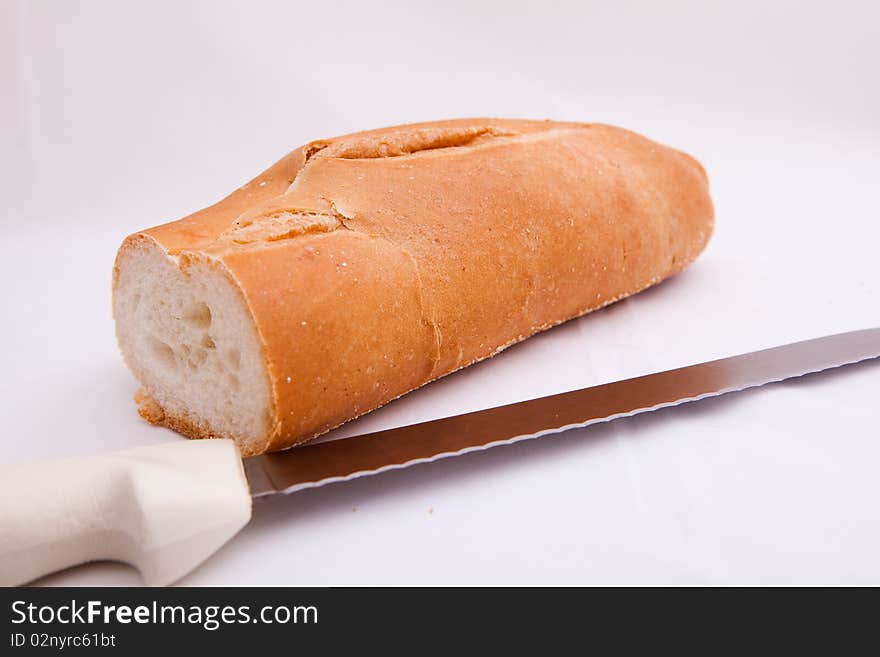 Slice of bread with a bread knife. Slice of bread with a bread knife