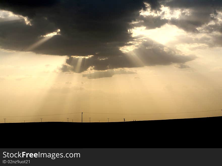 Sunset over field with green grass background