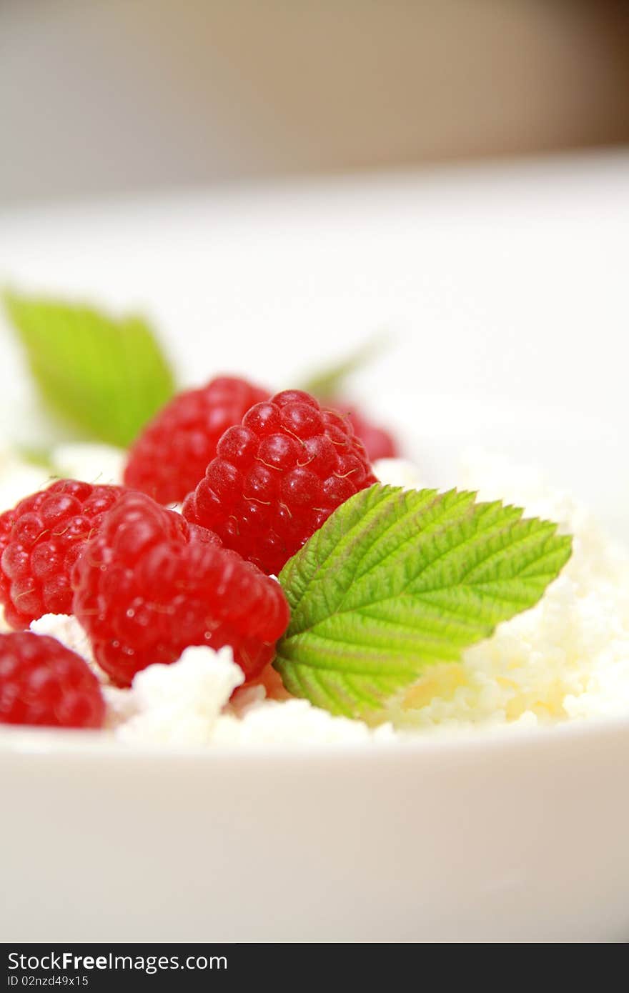 Cottage cheese and raspberry with leaf