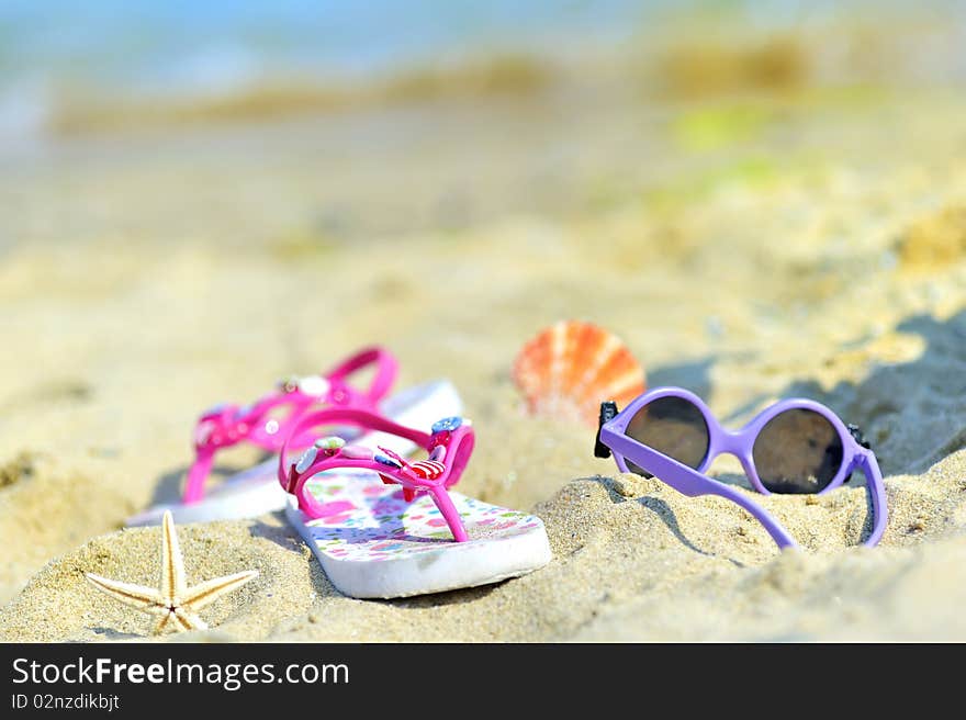 Children's beach accessories with sea in background