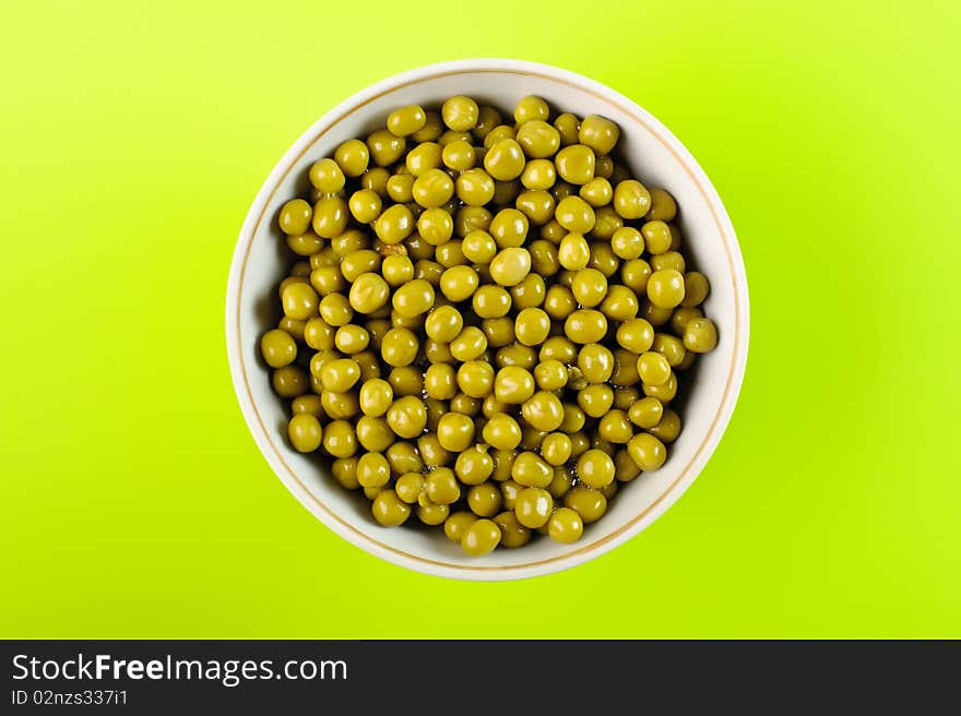 Wet green peas in the bowl