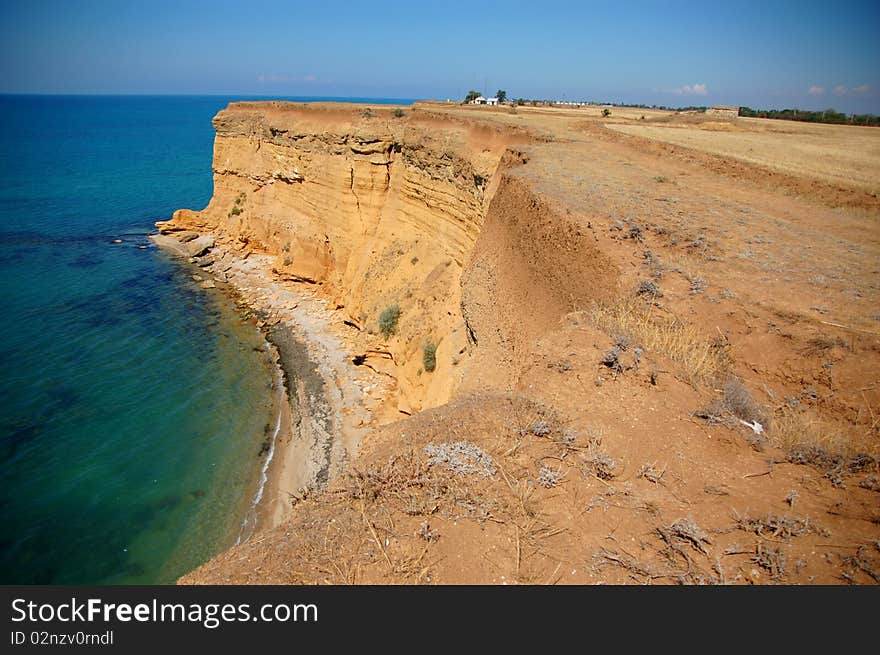 Rock-ribbed coast and the sea