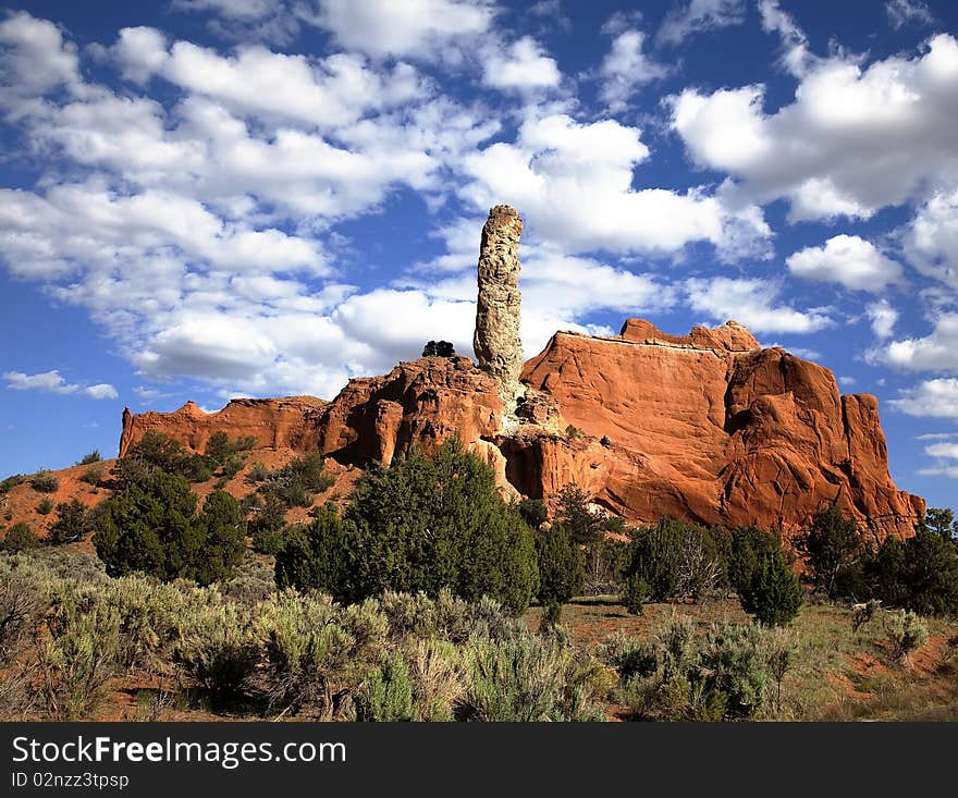 View of the red rock formations in Kodachrome Basin  with blue sky and clouds