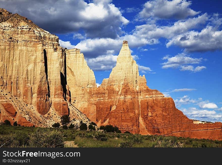 View of the red rock formations in Kodachrome Basin with blue sky and clouds