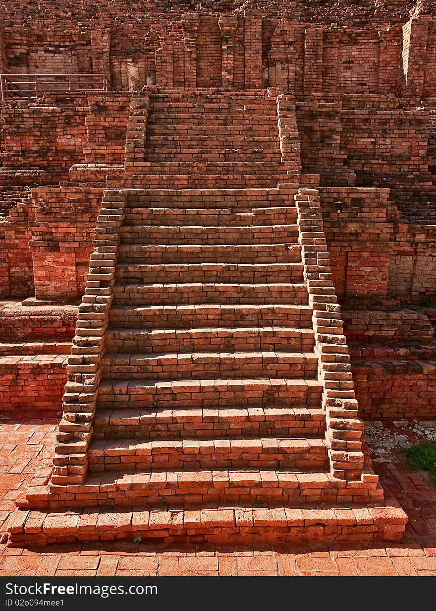 Ruined old stairs in front of Buddhist pagoda, Nakornprathom Thailand