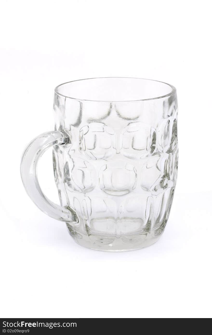 Empty glass beer tankard over white