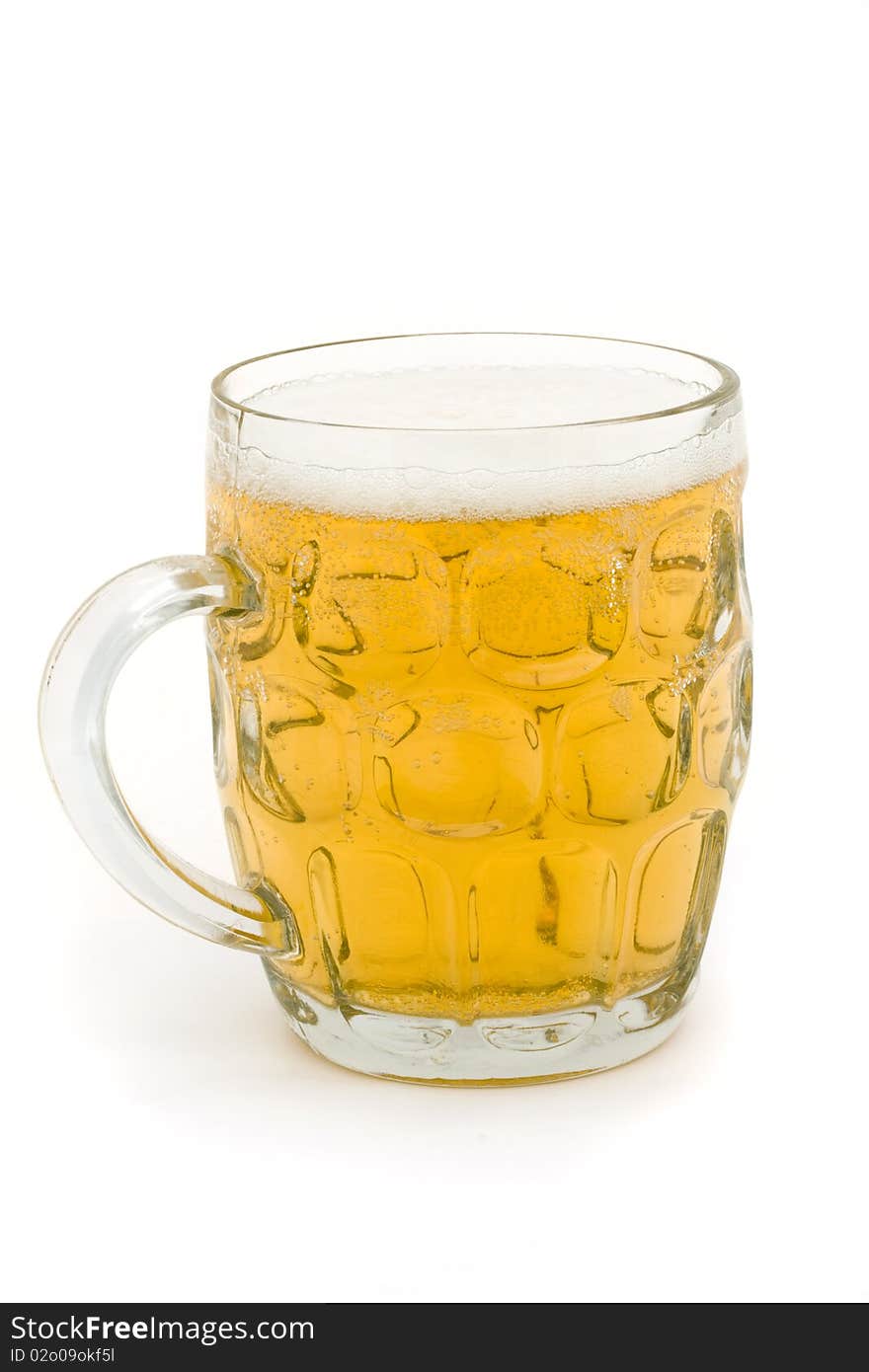 Full glass beer mug over white