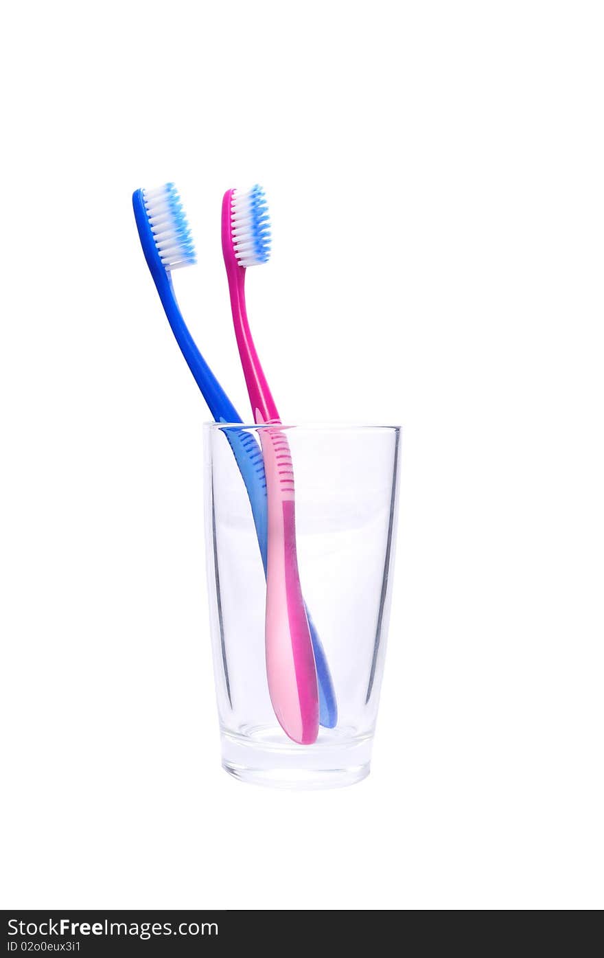 Two toothbrushes in the glass