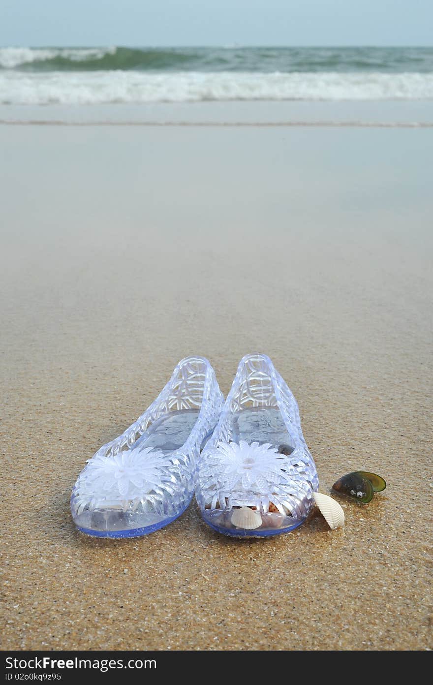 Girl's shoes on the beach. Girl's shoes on the beach