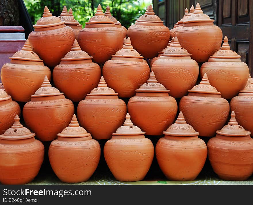 Clay jars arranging in tile ready for sell