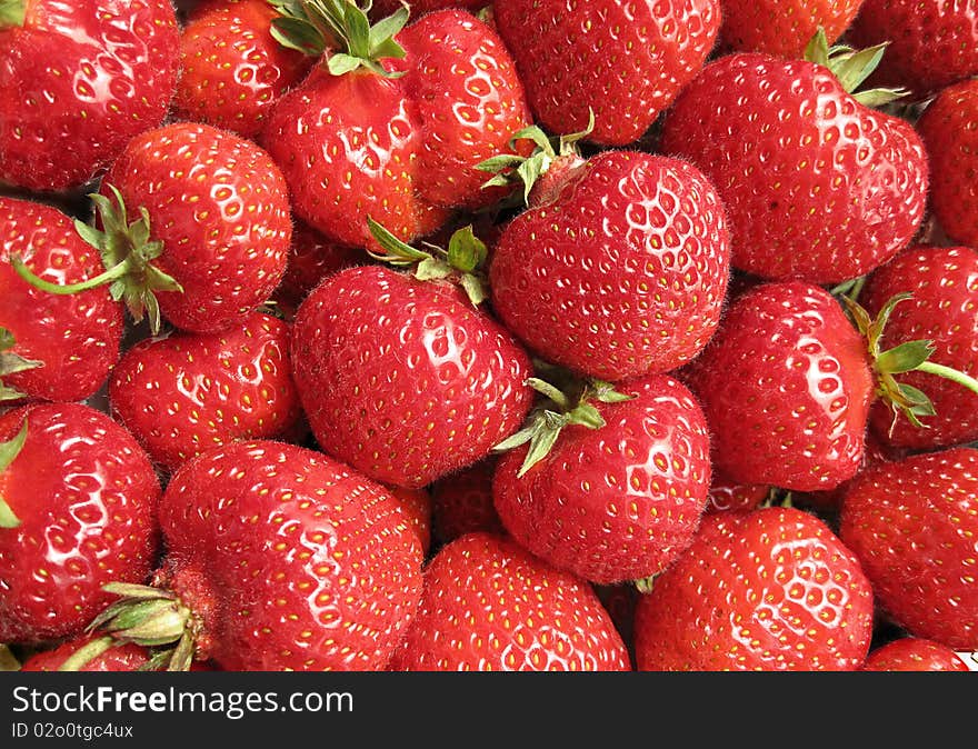 A lot of red strawberrieses (background)