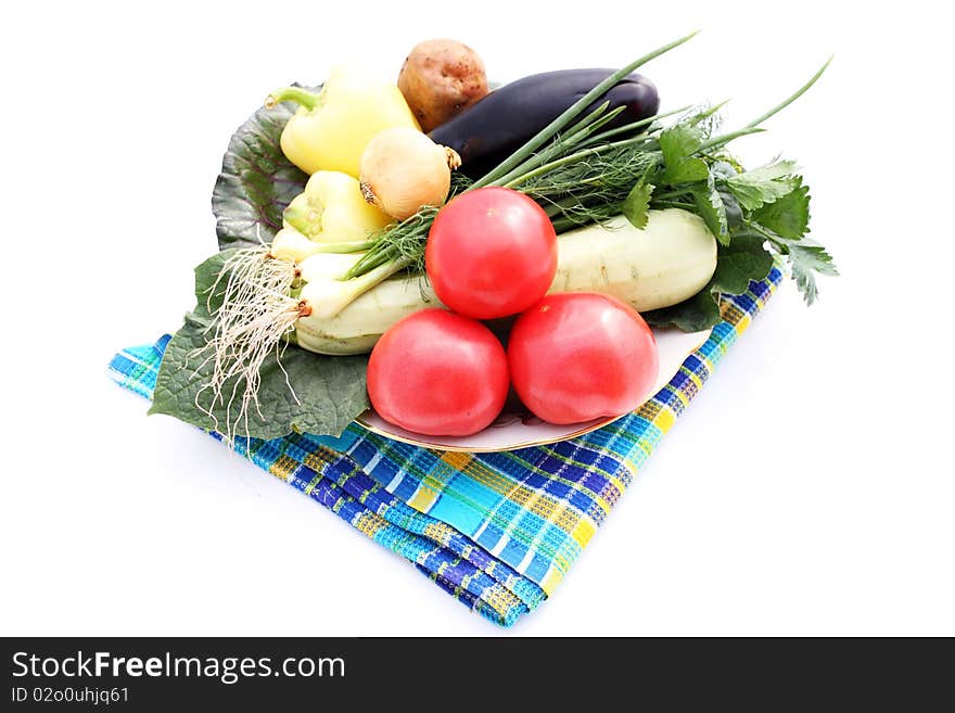 Still life fresh vegetables on plate on white background