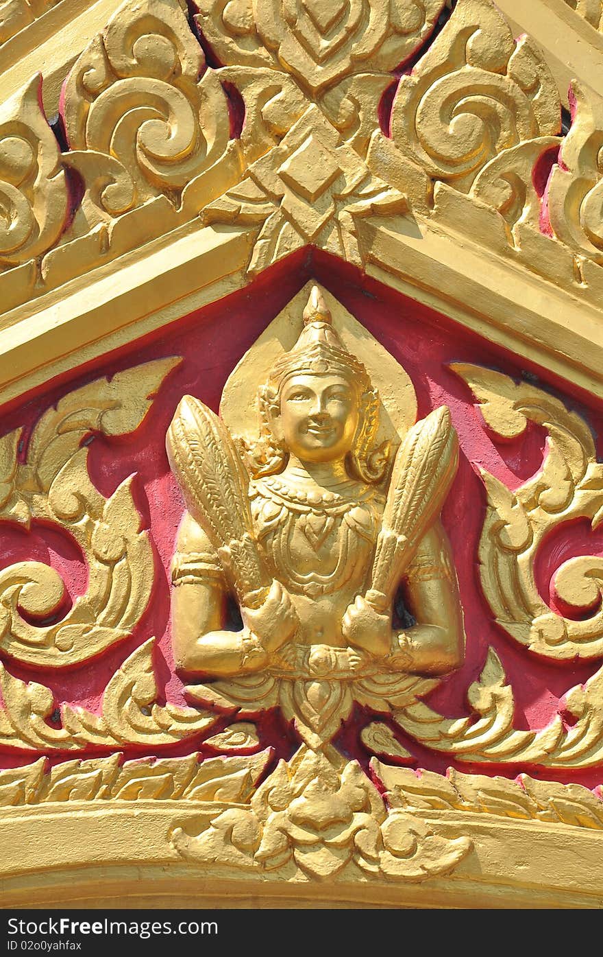 Gold Thai Goddess on the Temple arched entrance