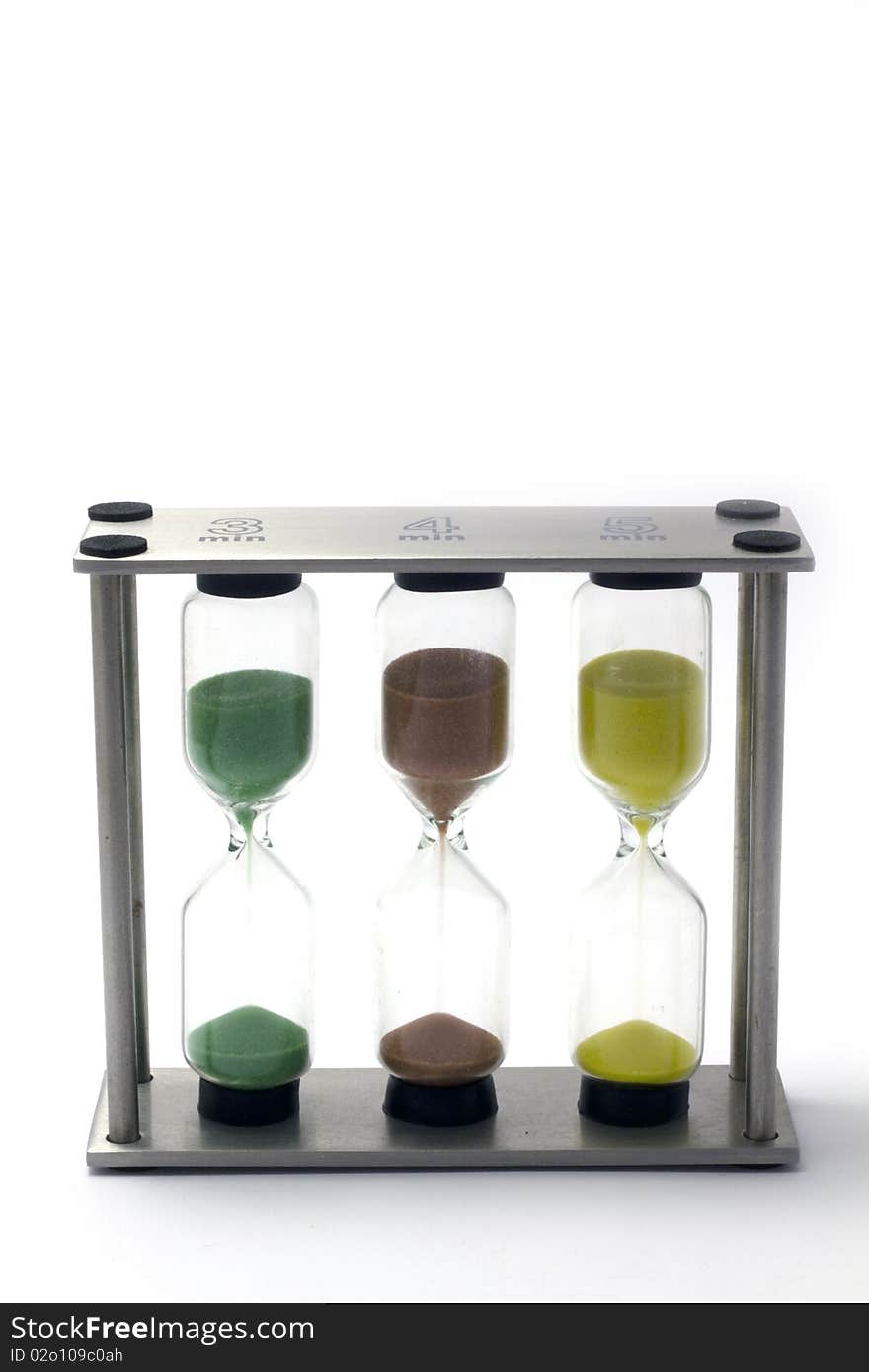 3-4-5-minute hour-glasses (egg-timers) on isolated white