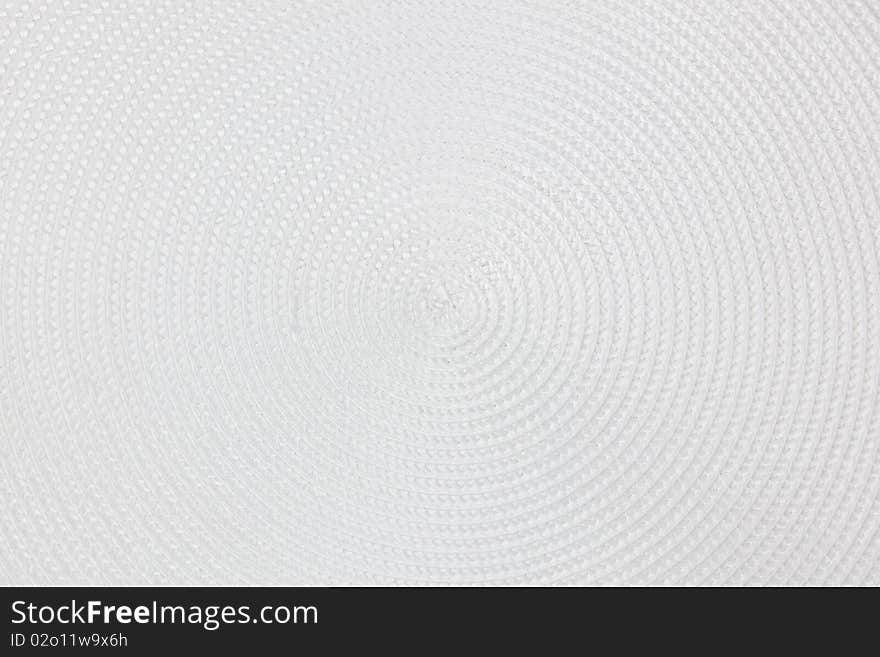 Circular pattern of a round white place mat. Circular pattern of a round white place mat