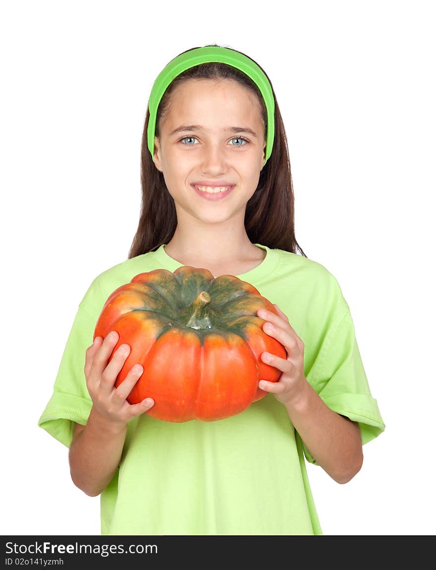 Happy girl in Halloween with a big pumpkin isolated on white background