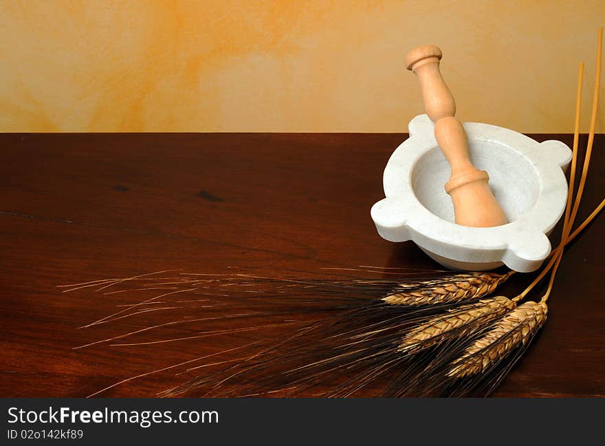 Flour, wheat ears and mortar on wood table. Flour, wheat ears and mortar on wood table