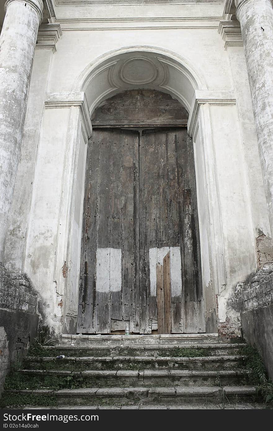 The door of an old church ina Rostov Veliky. Grass.