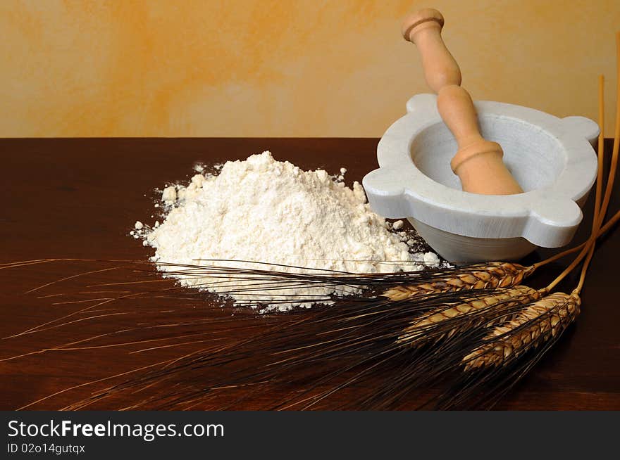 Flour, wheat ears wooden table. Flour, wheat ears wooden table