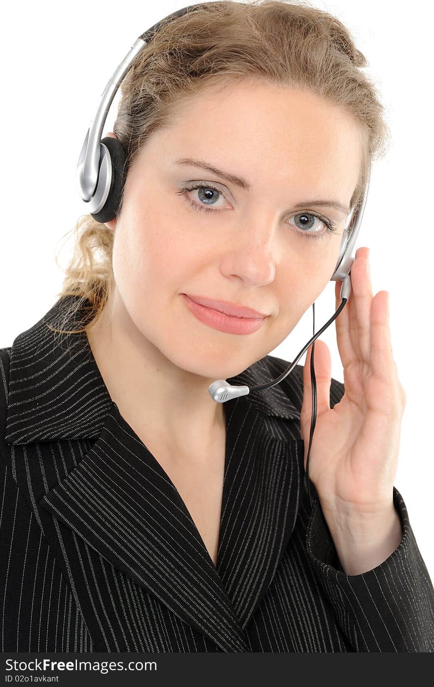 Young female customer service representative in headset, smiling  on a white background