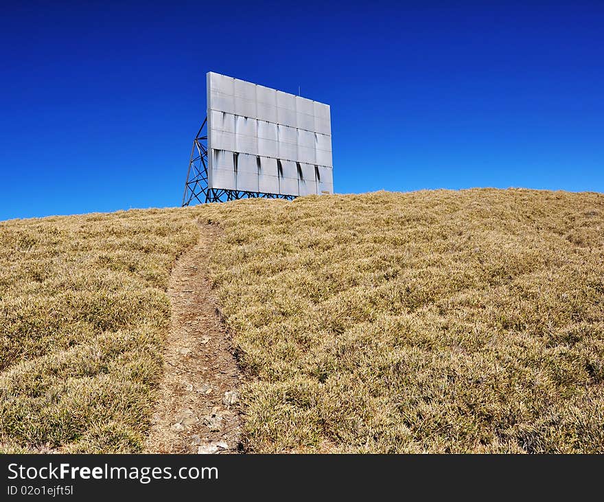 Path towards a billboard on the hill. Path towards a billboard on the hill