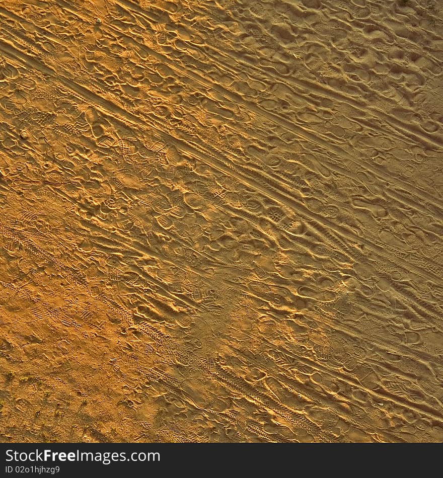 Footprints in sand, shot from bridge. Footprints in sand, shot from bridge.