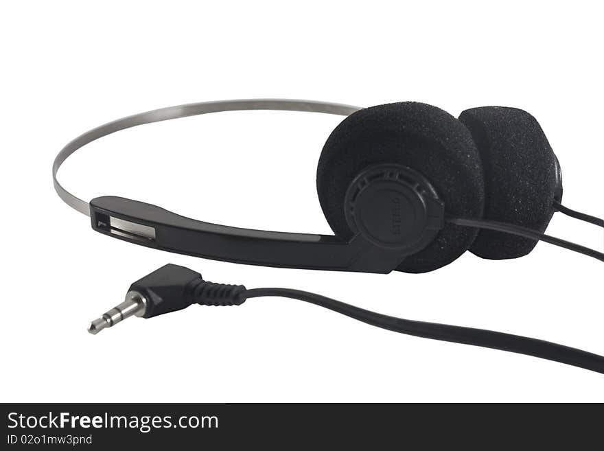 Black plastic headphones isolated on the white. Black plastic headphones isolated on the white