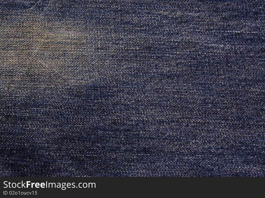 Blue jeans texture with white stain.