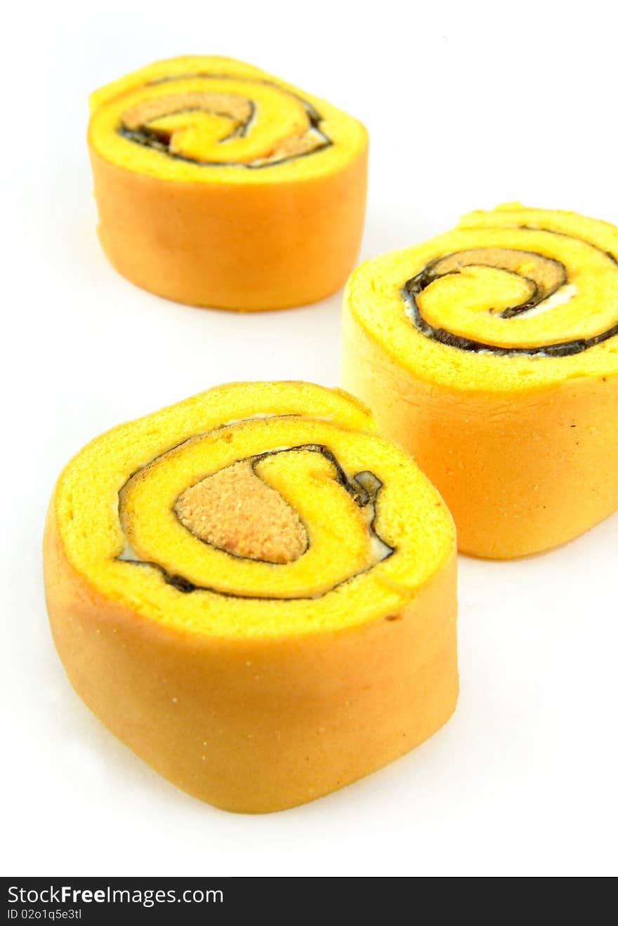 Close-up sweet cake rolls in white background