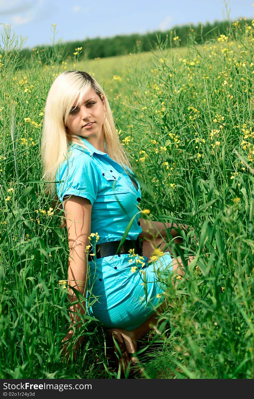 Portrait of a young beautiful woman in the field. Outdoor shoting. Portrait of a young beautiful woman in the field. Outdoor shoting