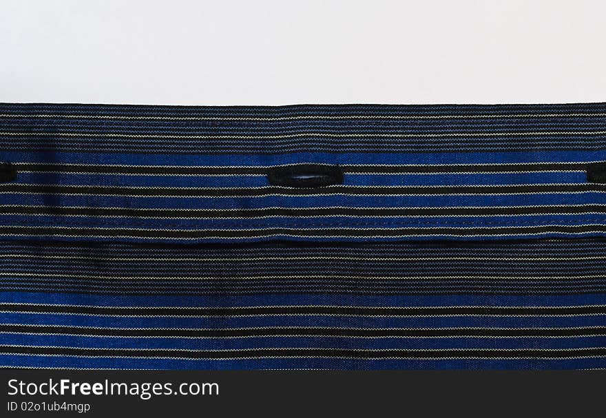 Blue striped fabric texture with buttonhole. Blue striped fabric texture with buttonhole.