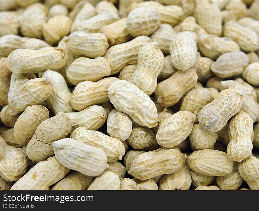 Closeup on pile of peanuts with shells