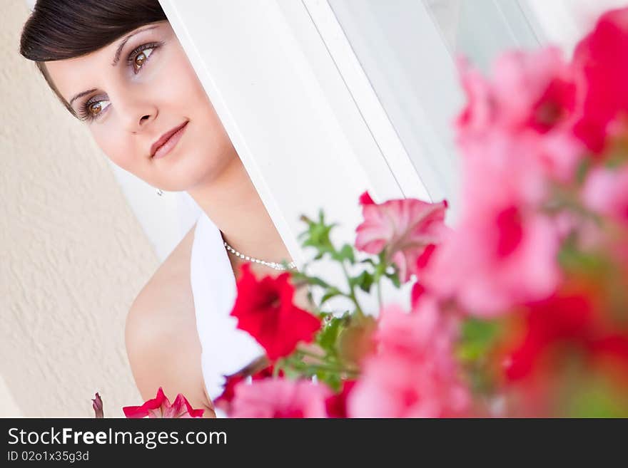 Attractive young woman face with flowers