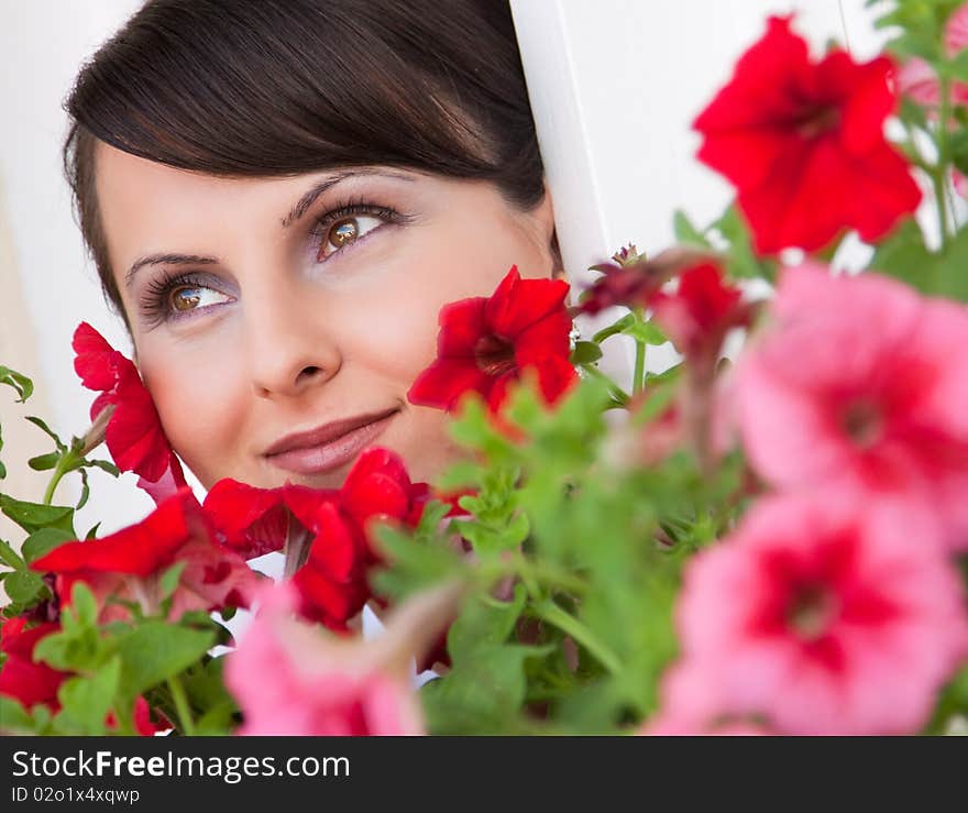 Attractive young woman face with flowers