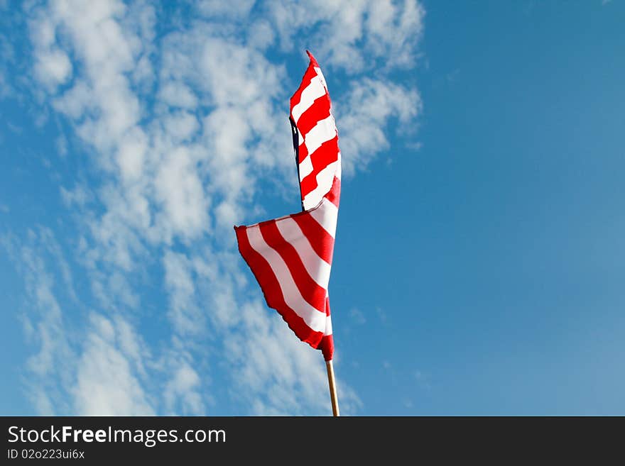 an american flag waving in the wind