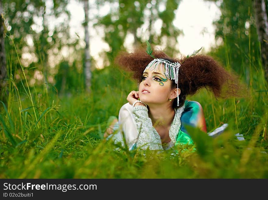 Young girl in forest, fantasy make-up. Young girl in forest, fantasy make-up