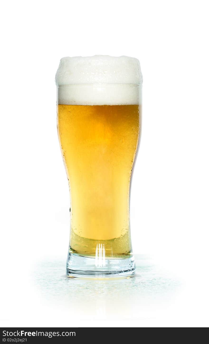 A glass of light beer isolated on white background with clipping path