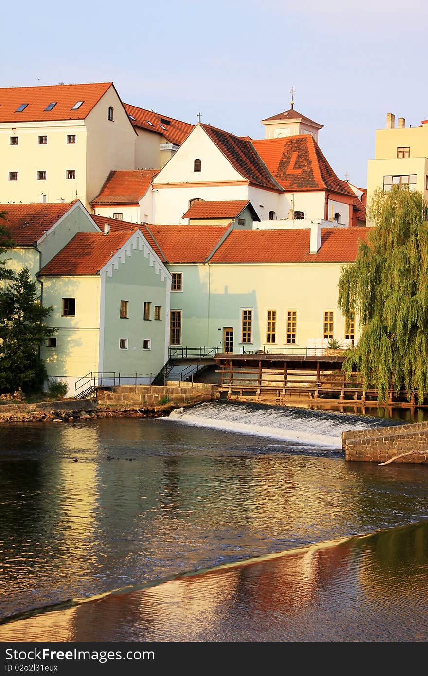 The colorful medieval town Pisek in Czech Republic with gothic deanery Church above the river Otava